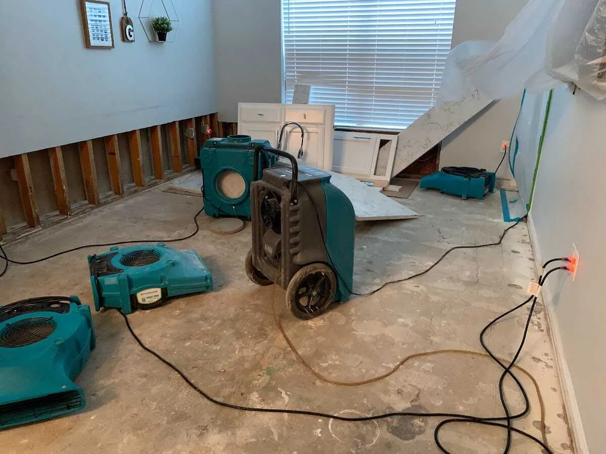 Dehumidifier in flood-cut room for Water Damage Restoration in Lindon